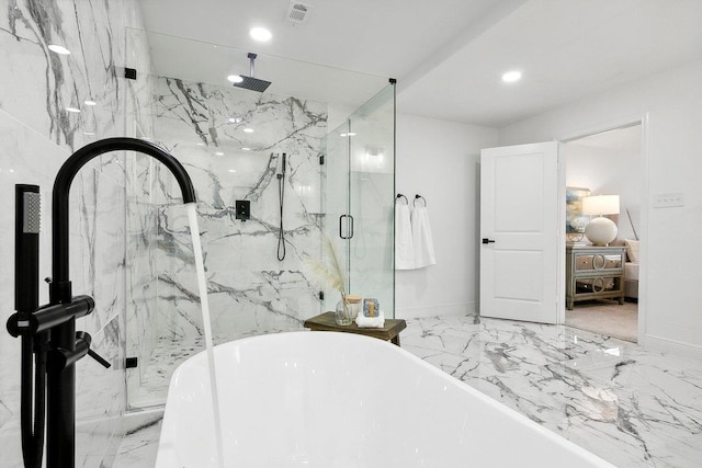 bathroom with separate shower and tub