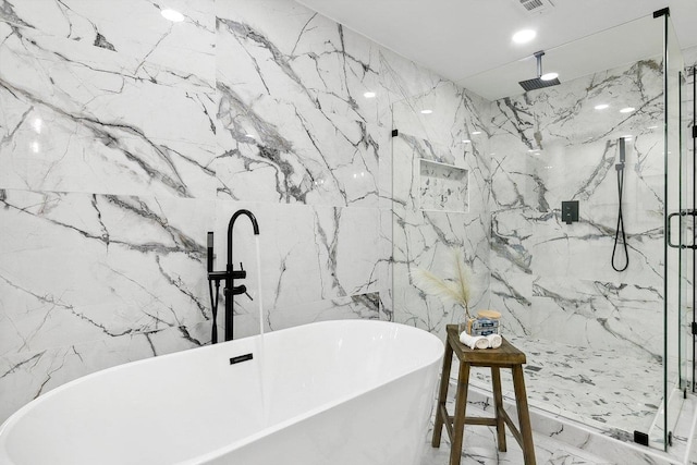 bathroom featuring separate shower and tub and tile walls