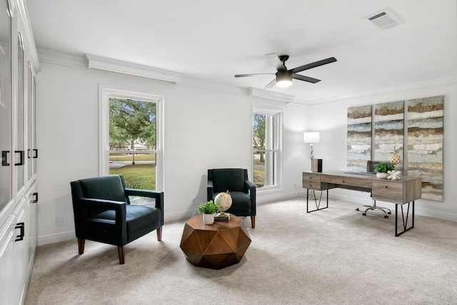 home office featuring light carpet, crown molding, and ceiling fan