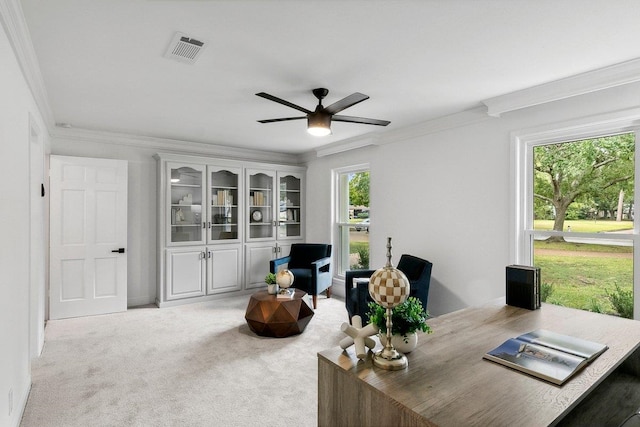 carpeted home office with a wealth of natural light and ornamental molding