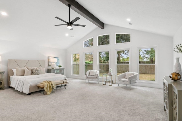 bedroom featuring beam ceiling, ceiling fan, high vaulted ceiling, multiple windows, and light carpet