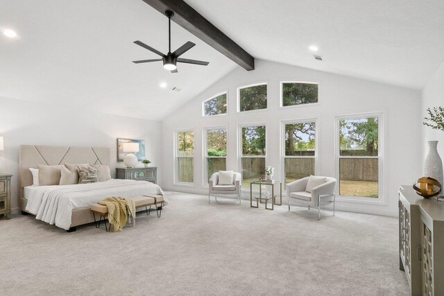 bedroom featuring beam ceiling, ceiling fan, high vaulted ceiling, multiple windows, and light carpet