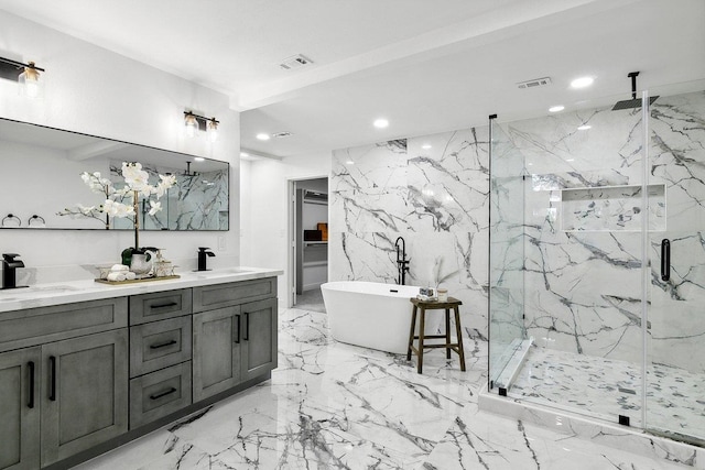 bathroom featuring separate shower and tub and vanity