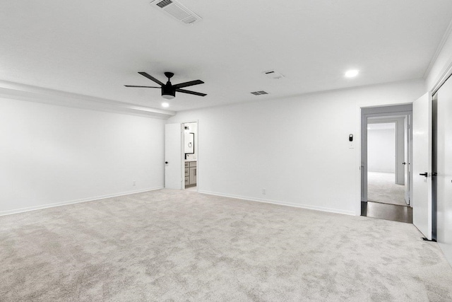 unfurnished room featuring ceiling fan and light colored carpet