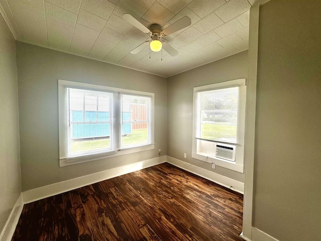 empty room with ceiling fan, cooling unit, and dark hardwood / wood-style flooring