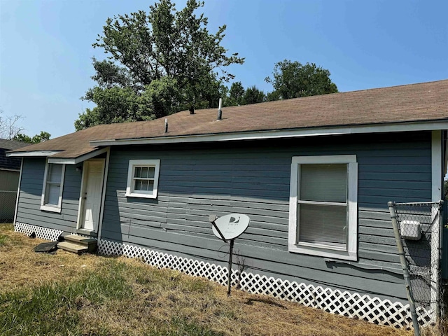 view of home's exterior with a yard