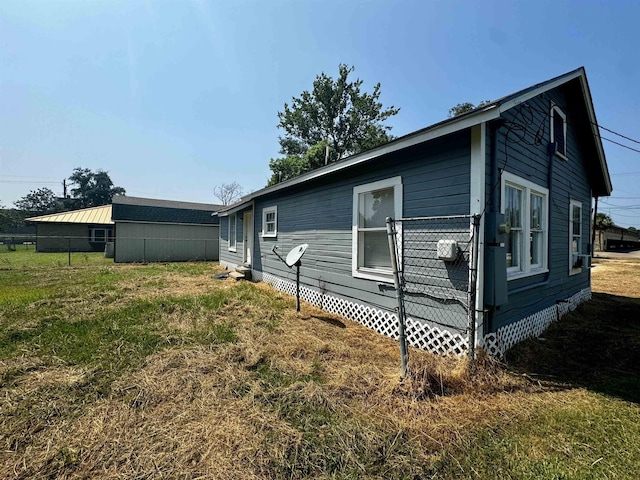 view of home's exterior featuring a lawn