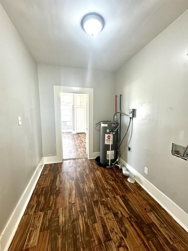 utility room featuring water heater