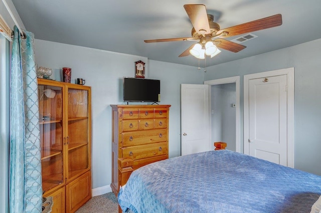 bedroom with ceiling fan and carpet floors