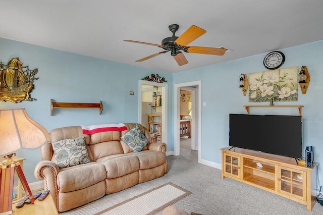 living room with ceiling fan and carpet floors