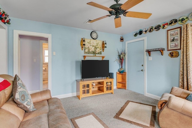 carpeted living room featuring ceiling fan