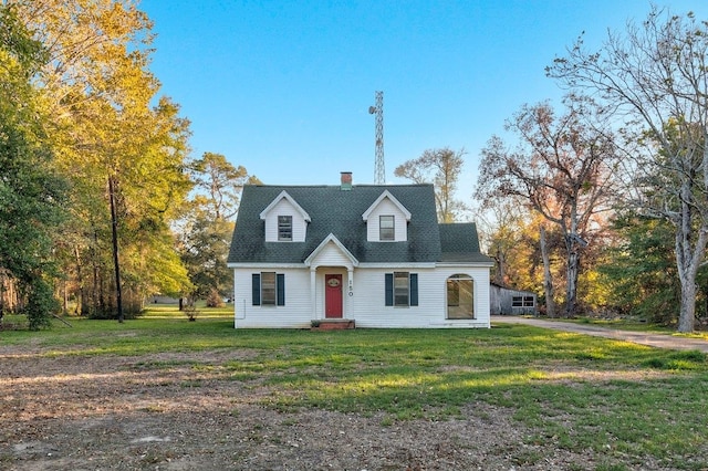 cape cod home featuring a front yard