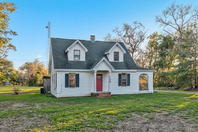 cape cod house featuring a front yard and central AC