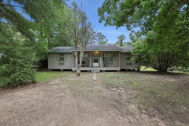 600 Bonner St, Silsbee, TX 77656 - rear view of house featuring covered porch