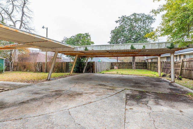 view of vehicle parking featuring a carport