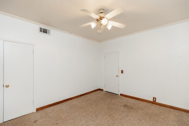 unfurnished room featuring crown molding, ceiling fan, and light carpet