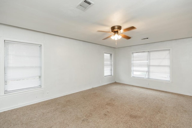 unfurnished room with light carpet and ceiling fan