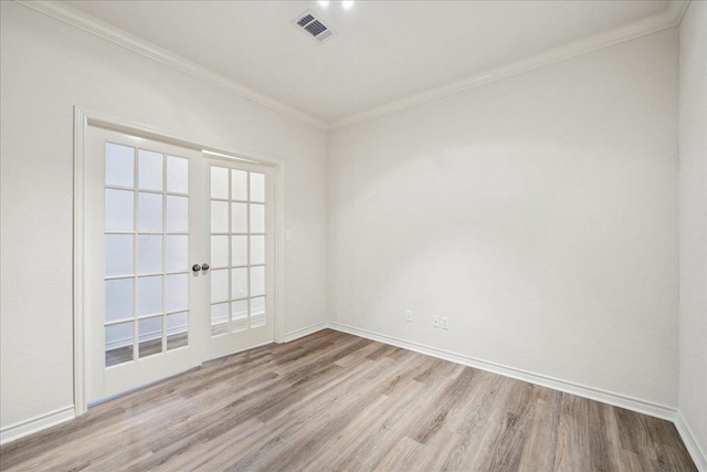 8076 Indian Blanket Dr, Beaumont, TX 77713 - spare room featuring wood finished floors, french doors, and ornamental molding