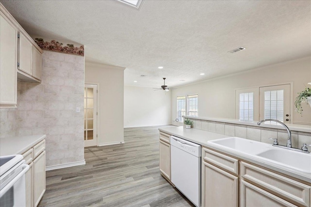 8076 Indian Blanket Dr, Beaumont, TX 77713 - kitchen with white appliances, ornamental molding, light wood-style flooring, a textured ceiling, and light countertops