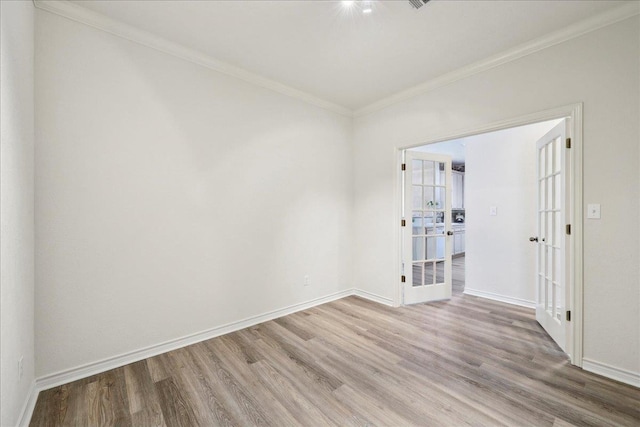 8076 Indian Blanket Dr, Beaumont, TX 77713 - spare room with wood finished floors, ornamental molding, and french doors