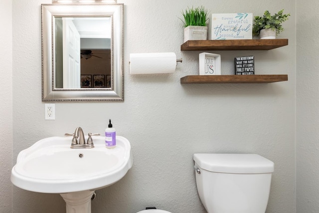 915 S 23rd St, Nederland, TX 77627 - half bathroom with toilet and a sink