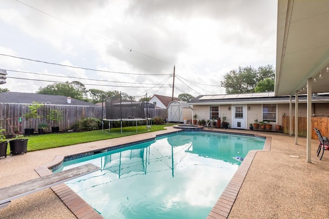 915 S 23rd St, Nederland, TX 77627 - view of pool with a patio area, a fenced backyard, an outbuilding, and a shed