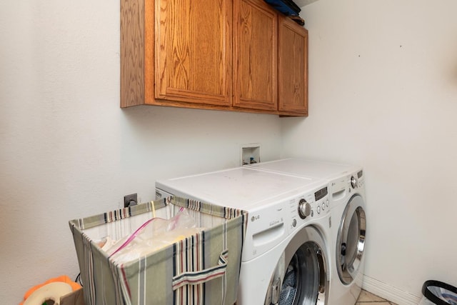 915 S 23rd St, Nederland, TX 77627 - clothes washing area featuring cabinet space and independent washer and dryer