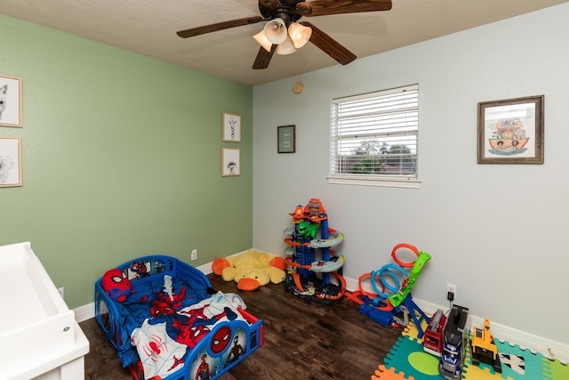 915 S 23rd St, Nederland, TX 77627 - rec room featuring baseboards, a ceiling fan, and wood finished floors