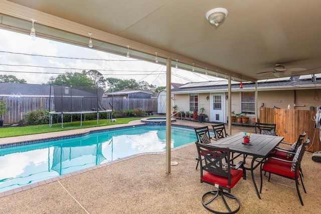 915 S 23rd St, Nederland, TX 77627 - view of pool with a fenced in pool, a fenced backyard, an in ground hot tub, a trampoline, and a patio