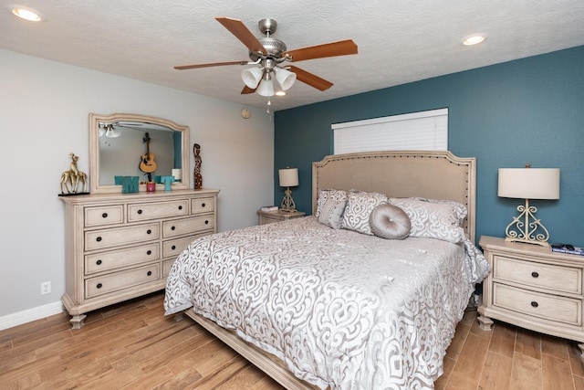 915 S 23rd St, Nederland, TX 77627 - bedroom with baseboards, wood finished floors, recessed lighting, and ceiling fan