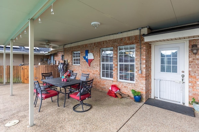915 S 23rd St, Nederland, TX 77627 - view of patio with fence, a ceiling fan, and outdoor dining area