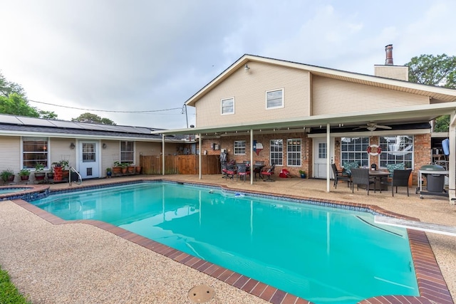 915 S 23rd St, Nederland, TX 77627 - outdoor pool featuring a ceiling fan, an in ground hot tub, and a patio