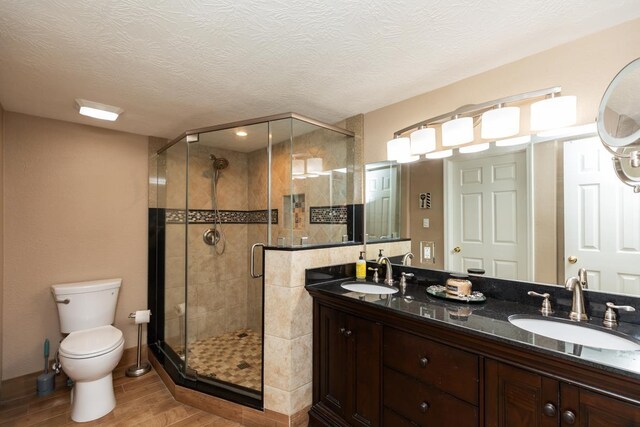915 S 23rd St, Nederland, TX 77627 - full bath with a stall shower, wood finished floors, a sink, and toilet