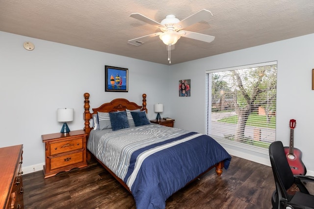 915 S 23rd St, Nederland, TX 77627 - bedroom featuring baseboards, a ceiling fan, wood finished floors, and a textured ceiling