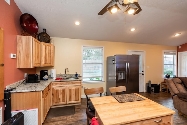 915 S 23rd St, Nederland, TX 77627 - kitchen featuring plenty of natural light, dark wood-style floors, a sink, and fridge with ice dispenser