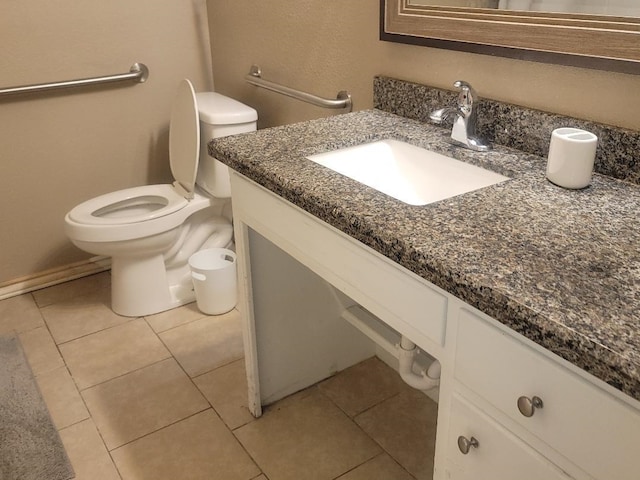 bathroom featuring tile patterned flooring, vanity, and toilet