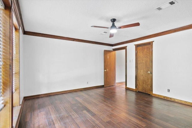 unfurnished bedroom with a textured ceiling, dark hardwood / wood-style flooring, ceiling fan, and ornamental molding