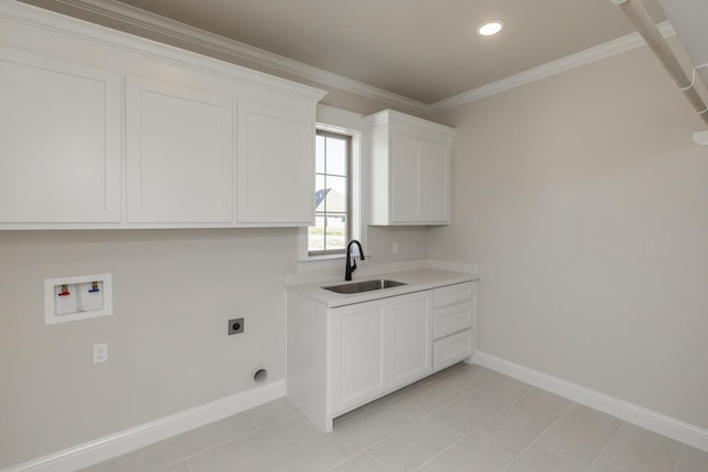 washroom featuring sink, cabinets, hookup for a washing machine, crown molding, and hookup for an electric dryer