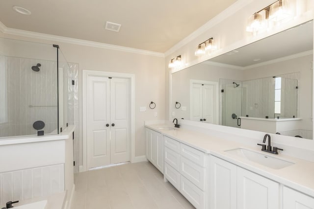 bathroom with ornamental molding, vanity, a shower with door, and tile patterned floors