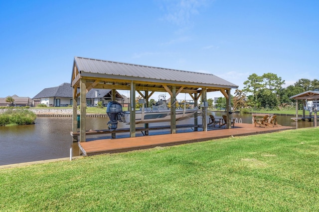 view of dock featuring a lawn and a water view