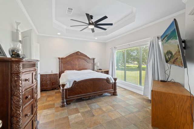 bedroom with ceiling fan, a raised ceiling, and crown molding