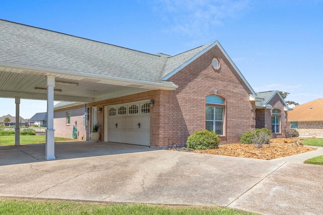 view of front of house featuring a garage and a carport