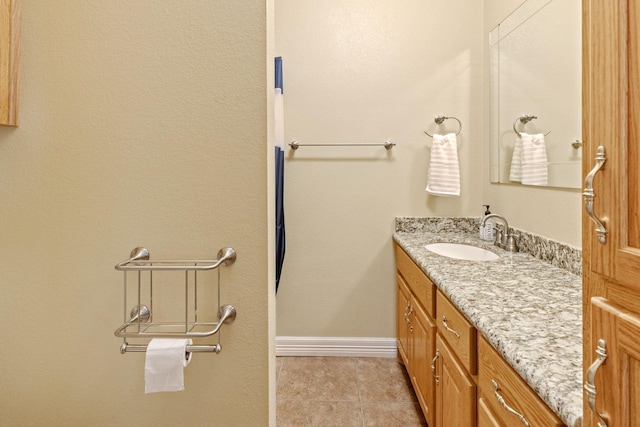 bathroom with tile patterned floors and vanity