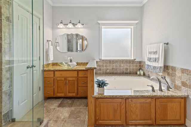 bathroom featuring crown molding, vanity, and independent shower and bath