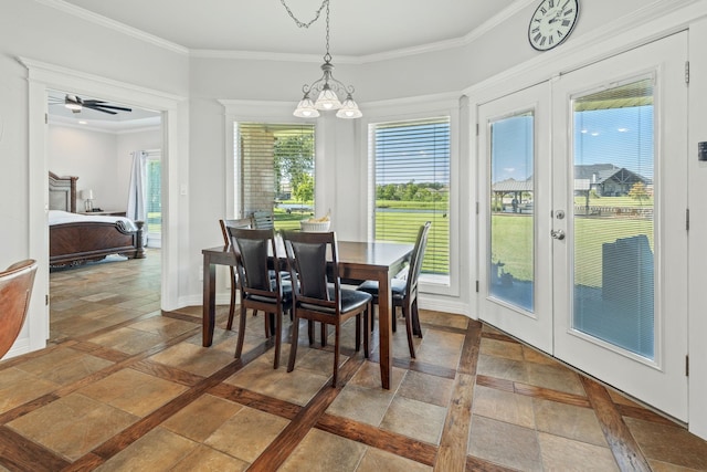 dining space featuring ceiling fan with notable chandelier, ornamental molding, and french doors