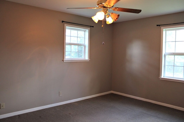 unfurnished room with carpet flooring and ceiling fan