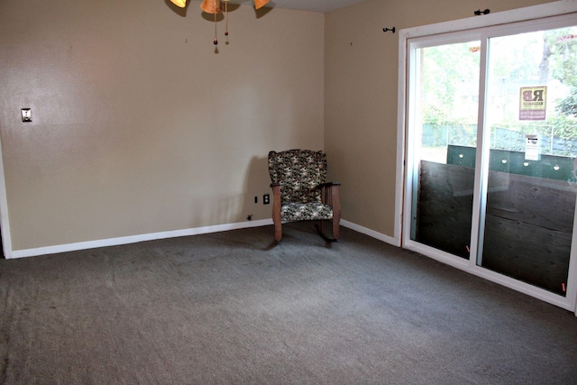 unfurnished room featuring ceiling fan and carpet