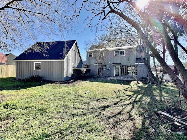 674 Ridgewood Dr, Port Neches, TX 77651 - back of house featuring board and batten siding and an outdoor structure