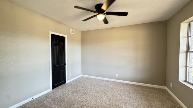 674 Ridgewood Dr, Port Neches, TX 77651 - unfurnished room with ceiling fan, carpet, baseboards, and a textured ceiling