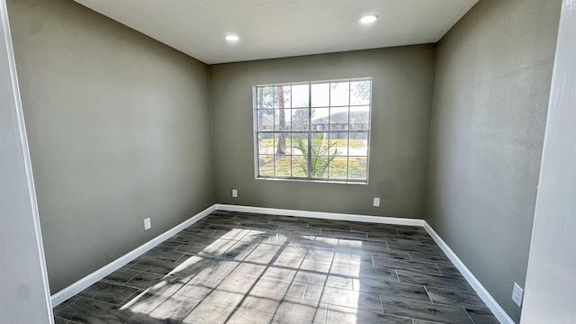 674 Ridgewood Dr, Port Neches, TX 77651 - unfurnished room featuring wood tiled floors, baseboards, and recessed lighting